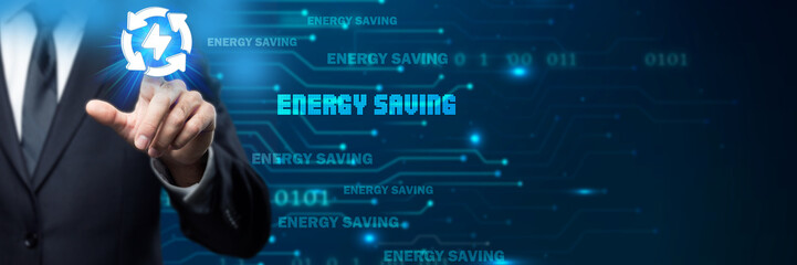 Businessman interacts with an energy saving icon in a digital, futuristic environment, symbolizing power conservation, efficiency, and sustainable technology for reducing energy consumption...