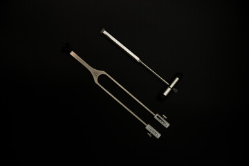 neurological hammer on a black background. medical instrument on a black background, medical...