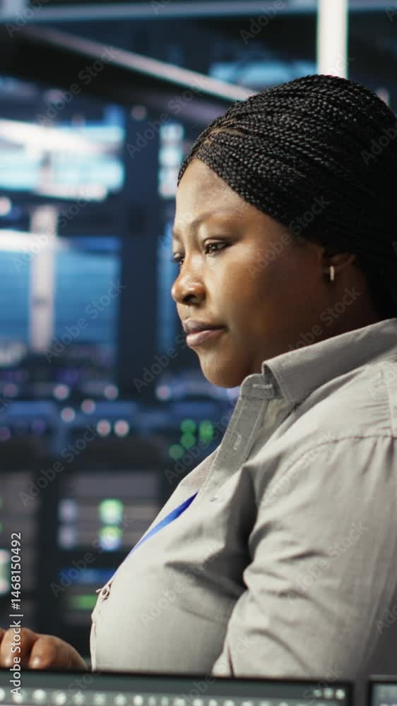 Poster vertical video portrait of joyous server hub technician using ai visualization insights to optimize 