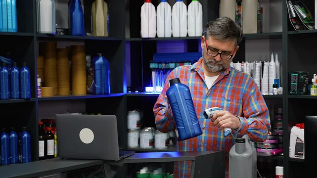 Senior Seller Scanning Motor Oil with Barcode Reader