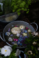 Rustic floral arrangement floating in metal basin