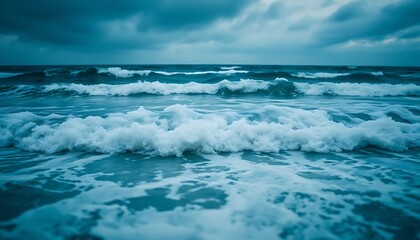 blue ocean with waves coming in and out of the water