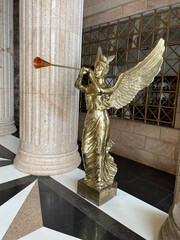 A gold trumpeting Angel inside the Temple of Leah