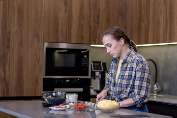Woman Slicing Ingredients for Quiche in the kitchen.