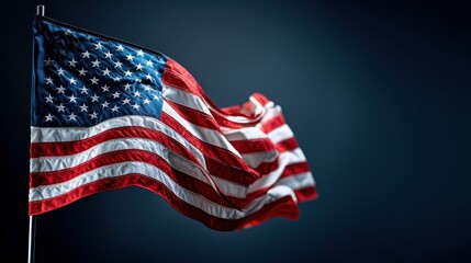 Obraz premium Waving American flag against dark background.