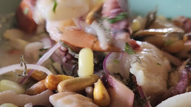Mixing up a bowl of Peruvian ceviche
