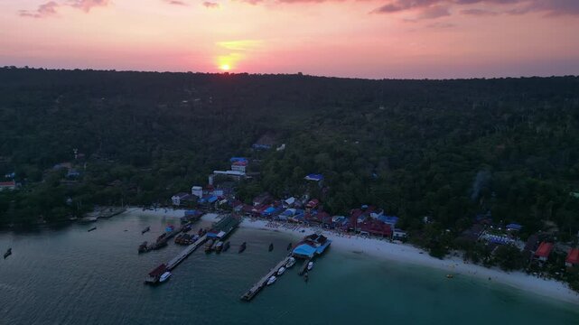 9.3.25 Koh Rong KHM, sunset island village. Smooth aerial view flight drone