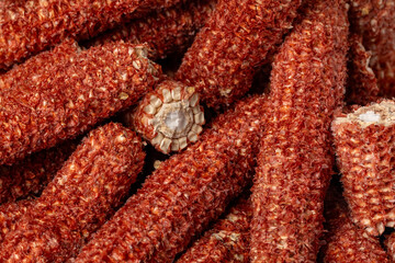 Pile of corn cobs. Agriculture waste, biofuel feedstock and ethanol concept.