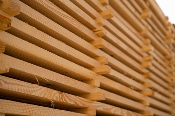 Diagonal closeup of wooden board edges showing saw marks and fibers
