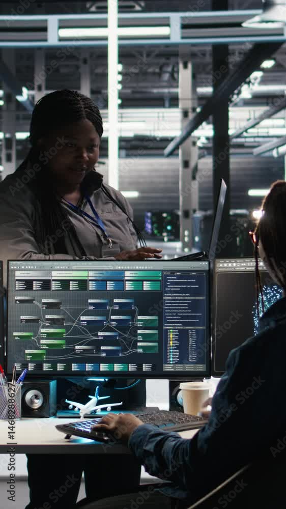 Poster vertical video data center manager supervising technician using node tree software to analyze datase