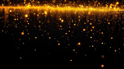 Golden glittering particles softly scattered over a dark background creating a warm and magical glowing effect