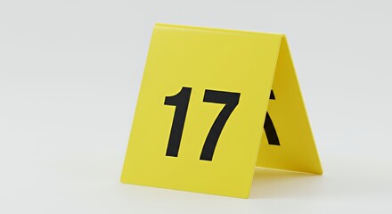 Isolated Yellow Triangular Evidence Marker Numbered Seventeen on White Background for Crime Scene Investigation