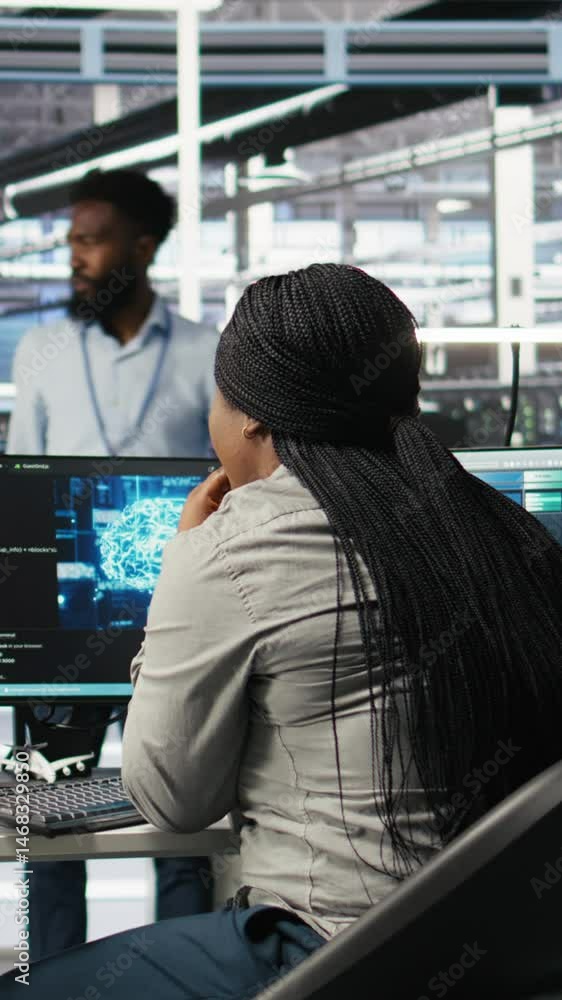 Poster vertical video data center staff member in office using ai deep learning algorithms to analyze datas
