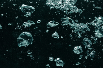 Many water bubbles on black background, closeup