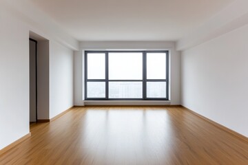 Modern empty apartment with large windows showcasing a view of the city skyline