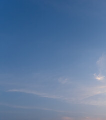 Front view and full frame of beautiful morning or evening blue and orange sky with cloudy while sunsets or sunrises taken at the sea used as natural blackground texture