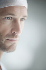 Fototapeta premium portrait of surgeon serious expression positioned on left side of frame