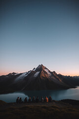 Friends at the mountains, travel, exploration as a group, night sky, dusk, epic shot, lots of negative space, overlooking nature, the natural world, beauty, creation, blue, premium shot, 9 friends