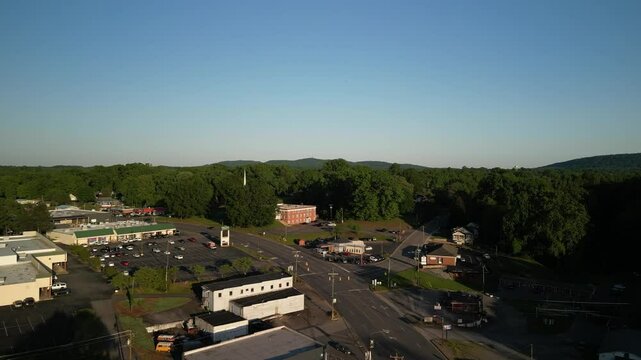 Aerial over small rural town of Elkin North Carolina at sunset