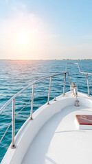 Fototapeta premium Serene sunset over yacht bow at sea - tranquil marine landscape