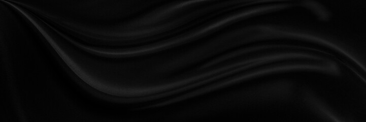Black gray satin dark fabric texture luxurious shiny that is abstract silk cloth background with patterns soft waves blur beautiful.