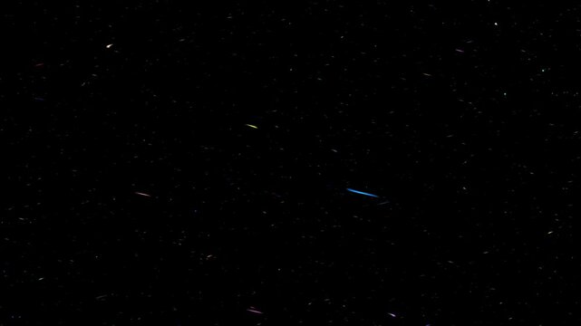 Abstract night sky background with chaotic movement of stars trails space debris elements planet long exposure forming zig zag track