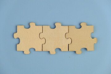 Obraz premium wooden jigsaw puzzle with missing puzzle for a text template. Above photo of isolated on the isolated background
