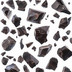 Chocolate chunks scattered randomly on a white background