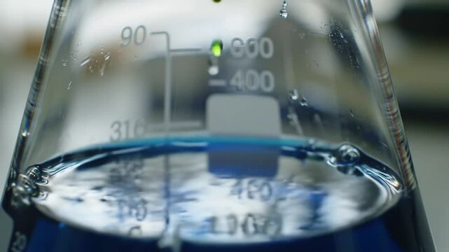 Blue Chemical Reaction in Erlenmeyer Flask, Close Up