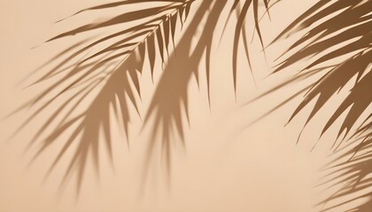 Obraz premium Palm leaves casting shadows on a beige wall, creating a minimalist and tropical aesthetic, the light source is positioned to the side