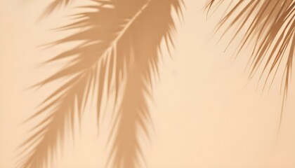 Obraz premium Palm leaves casting shadows on a beige wall, creating a minimalist and tropical aesthetic, the light source is positioned to the side