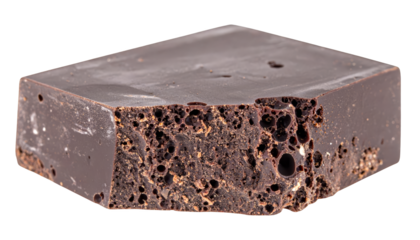 A rectangular piece of dark, porous chocolate is shown against a white background.