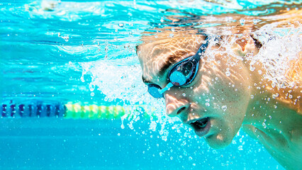 Underwater Close-Up of Competitive Swimmer in Action