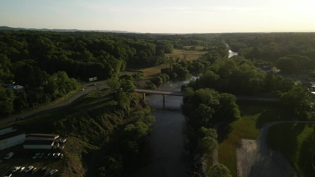 Aerial over bridge over Yadkin River in Elkin North Carolina at sunset
