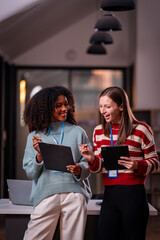 Two women with teamwork Laptop and research for articles, collaborations, and schedule evening, after-hours meetings.