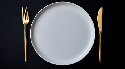 Minimalist served white plate with golden fork and knife, copy space, black background