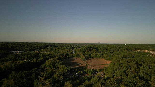 Aerial over crops and rural fields in Elkin North Carolina at sunset
