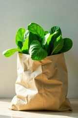 A sunlit paper bag filled with vibrant, freshly harvested leafy greens, symbolizing healthy eating and sustainable living