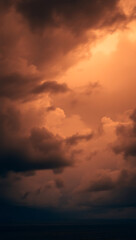 Naklejka premium Dramatic Stormy Sky: Captivating Abstract Cloudscape with Moody Atmosphere and Vibrant Orange Hues