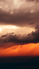 Fototapeta premium <b>Dramatic Clouds: Vibrant Sunset Colors in a Stormy Sky with Majestic Sky Textures and Scenic Vista</b>