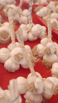 Fresh garlic displayed at local market in vibrant setting