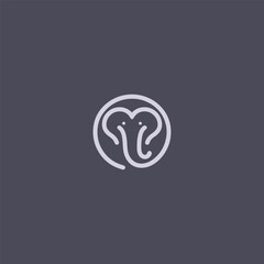 Elephant logo with a heart symbol in creative composition.