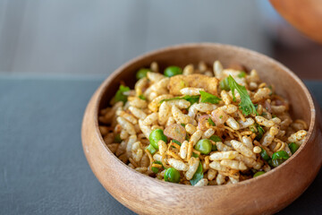 A bowl of food with rice and peas in it