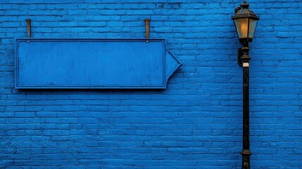 A blue painted brick wall with a sign and a lamp post