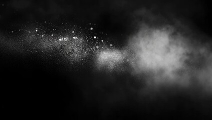 White dust and smoke swirl on black background