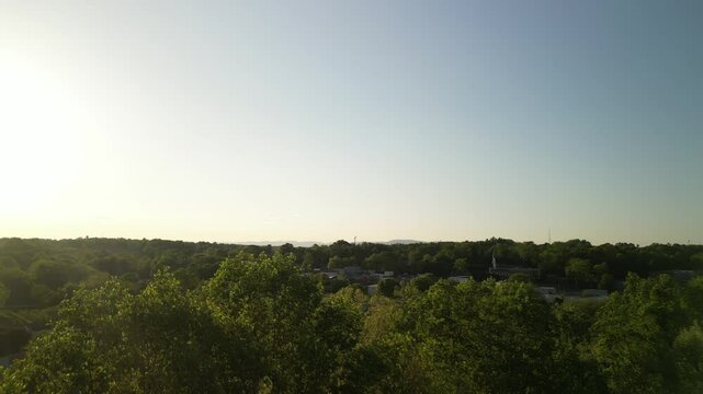 Aerial over small town Elkin in North Carolina at sunset in spring