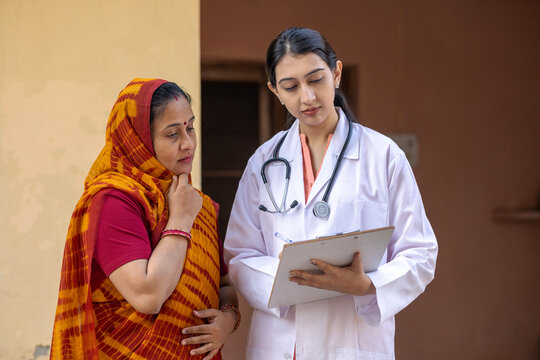 Concept of Indian rural women health problems in India. Indian female doctor consulting to unhealth rural woman. Rural India healthcare concept. Protection of cervical cancer in india