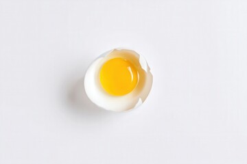 Single cracked egg with yolk and shell on white background
