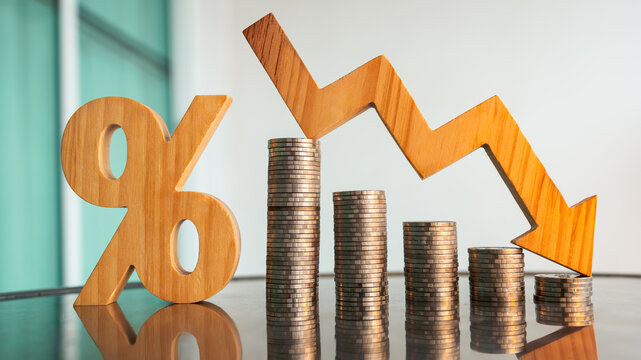 Percentage model, coin stack and down arrow, concepts for success, methods, systems of raising or lowering Fed interest rates to correct inflation concepts.