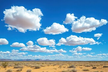 Fototapeta premium Vast desert landscape under a clear blue sky with puffy clouds and distant mountains, A vast, open desert landscape stretches out under a blue sky with fluffy white clouds